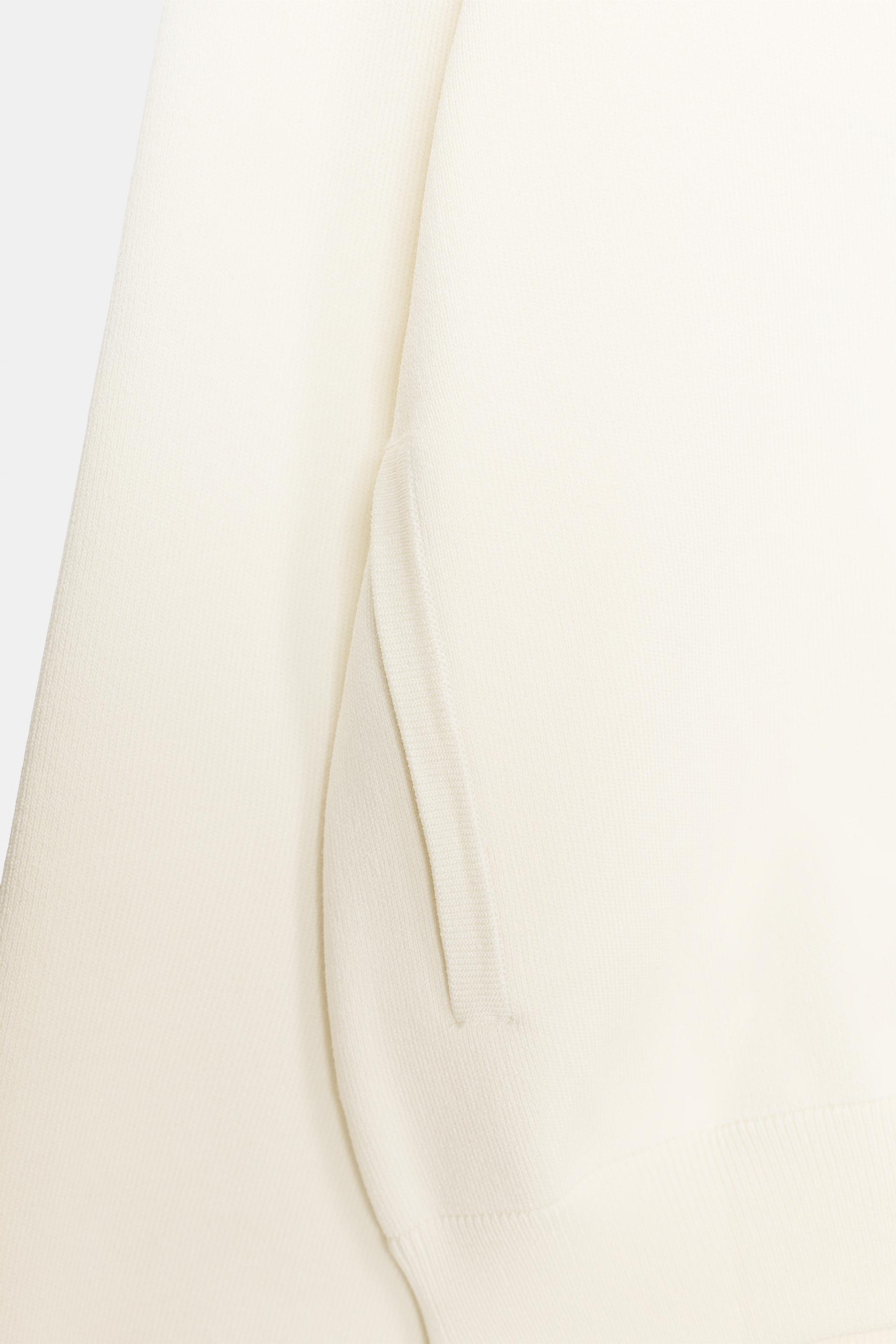 GILET EN MAILLE À BOUTON CONTRASTE